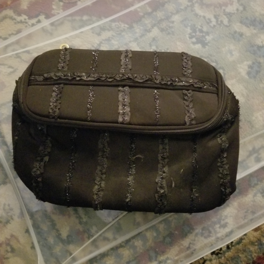 Make up bag or can be used as a clutch purse,
